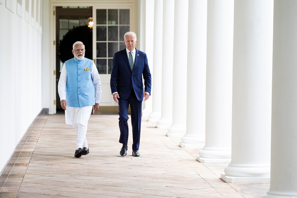 president Joe Biden walking with Prime Minister Narendra Modi