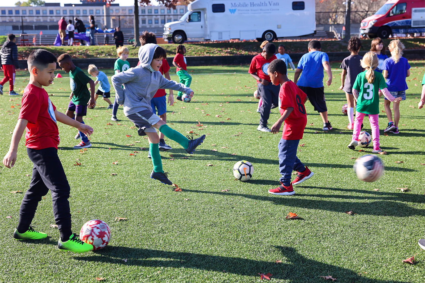 children playing soccer on Carter Playground