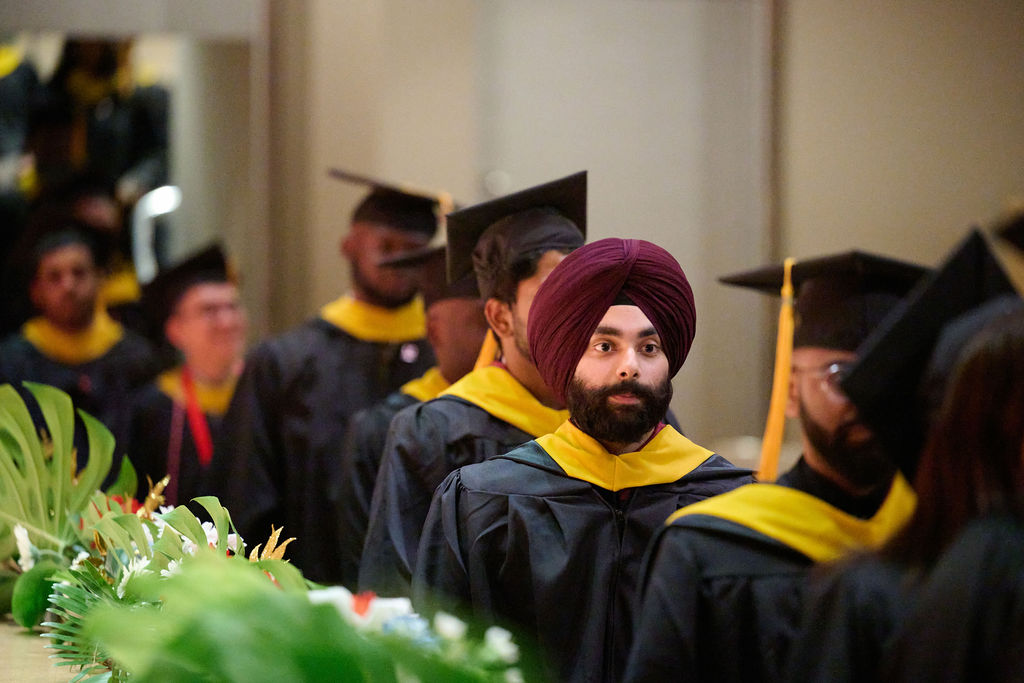 Graduates taking pictures at Northeastern's Toronto convocation.