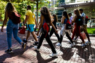 students walking across campus