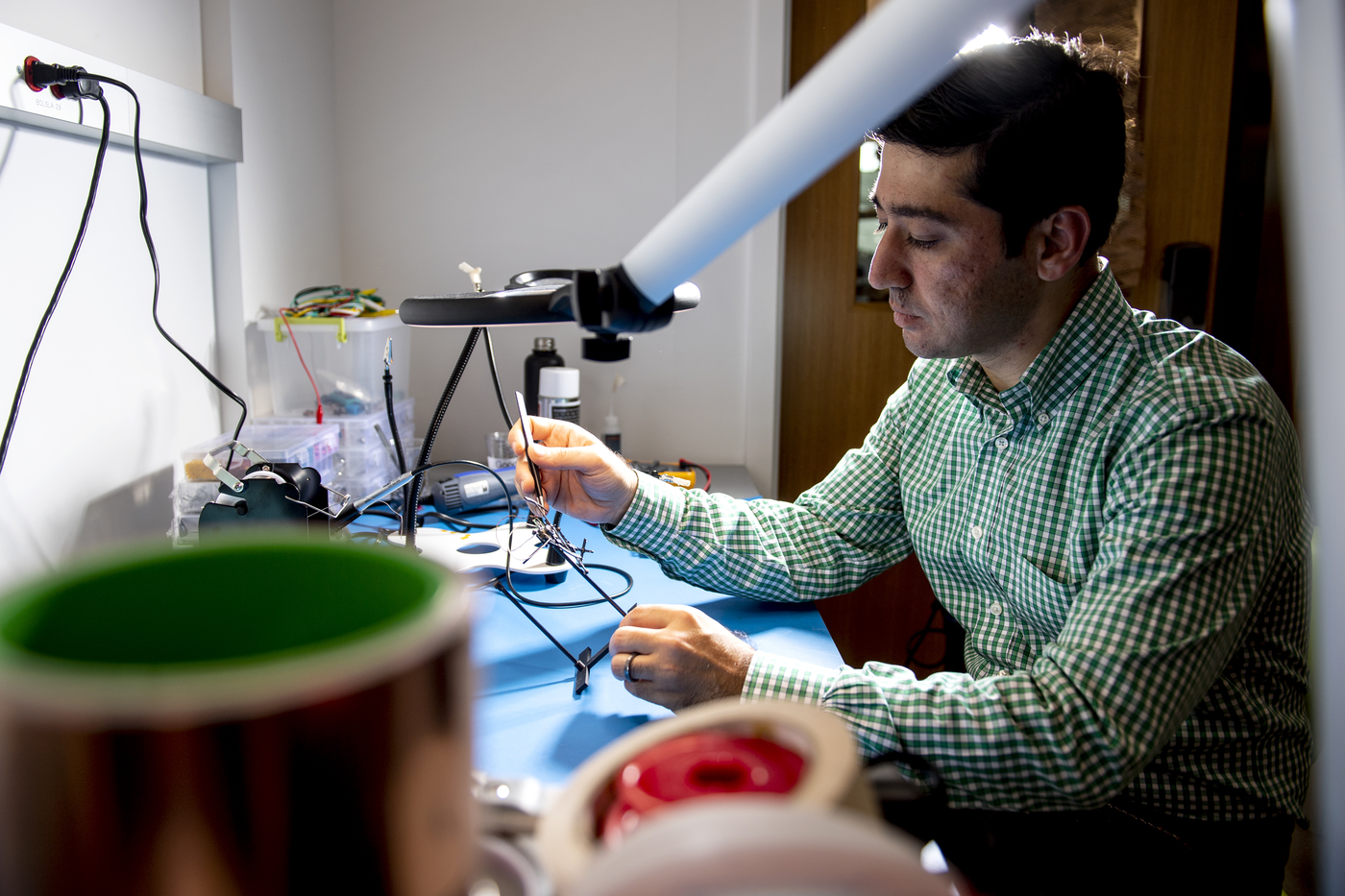 Alireza Ramezani working on the M4 robot.