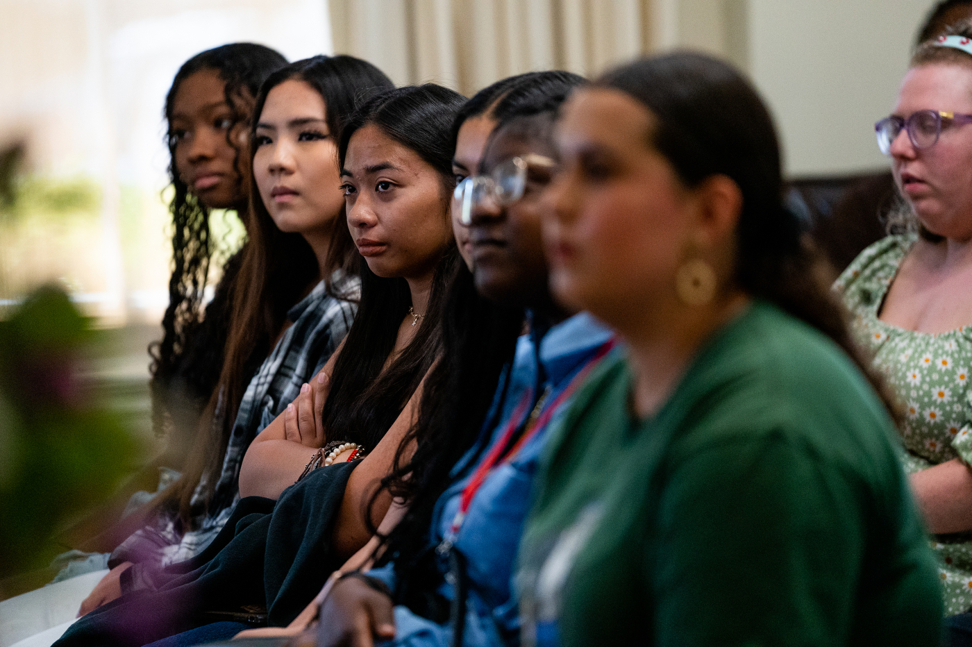 Row of students sitting and listening