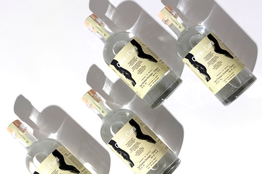 bottles of Cara a Cara mezcal on white background