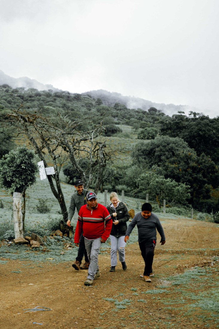 Jessica Pogranyi and Miguel Albarran walking with two Mexican people