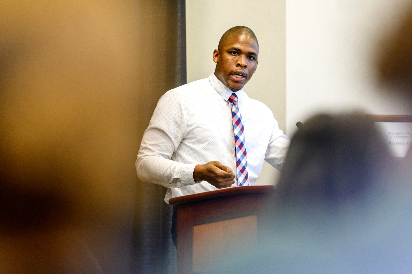 person speaking at Northeastern Youth Summer Jobs Program celebration