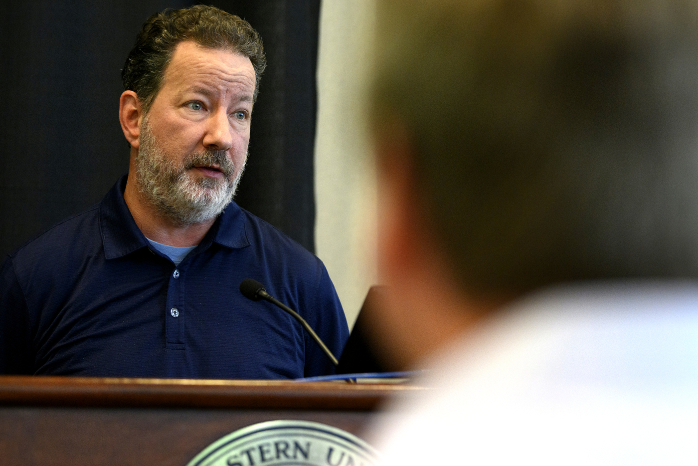 person speaking at Northeastern Youth Summer Jobs Program celebration