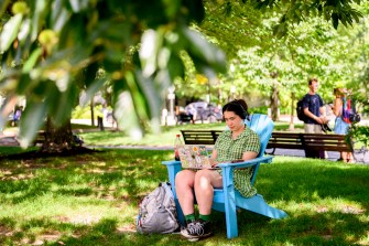Aubrey Burgess studying outside