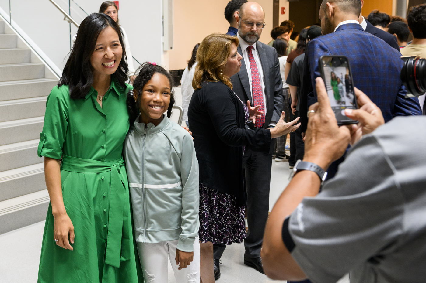 Mayor Michelle Wu posing with a student