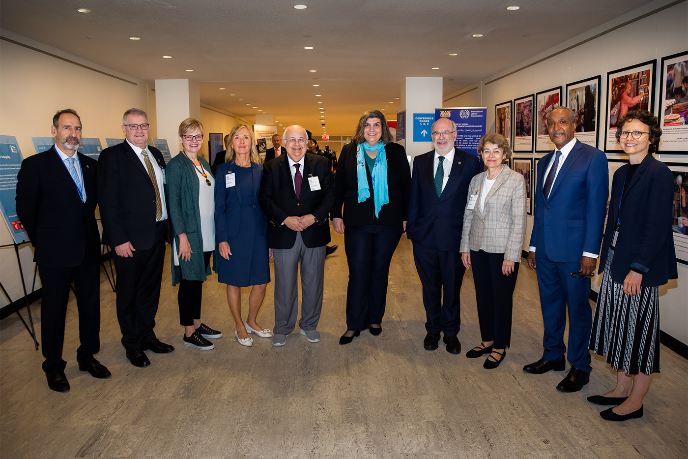 group photo of people wearing business attire and name tags