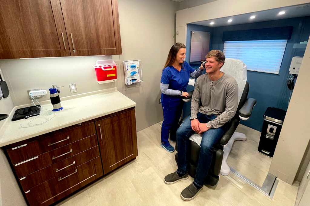 nurse and patient in an OnSpot Dermatology truck