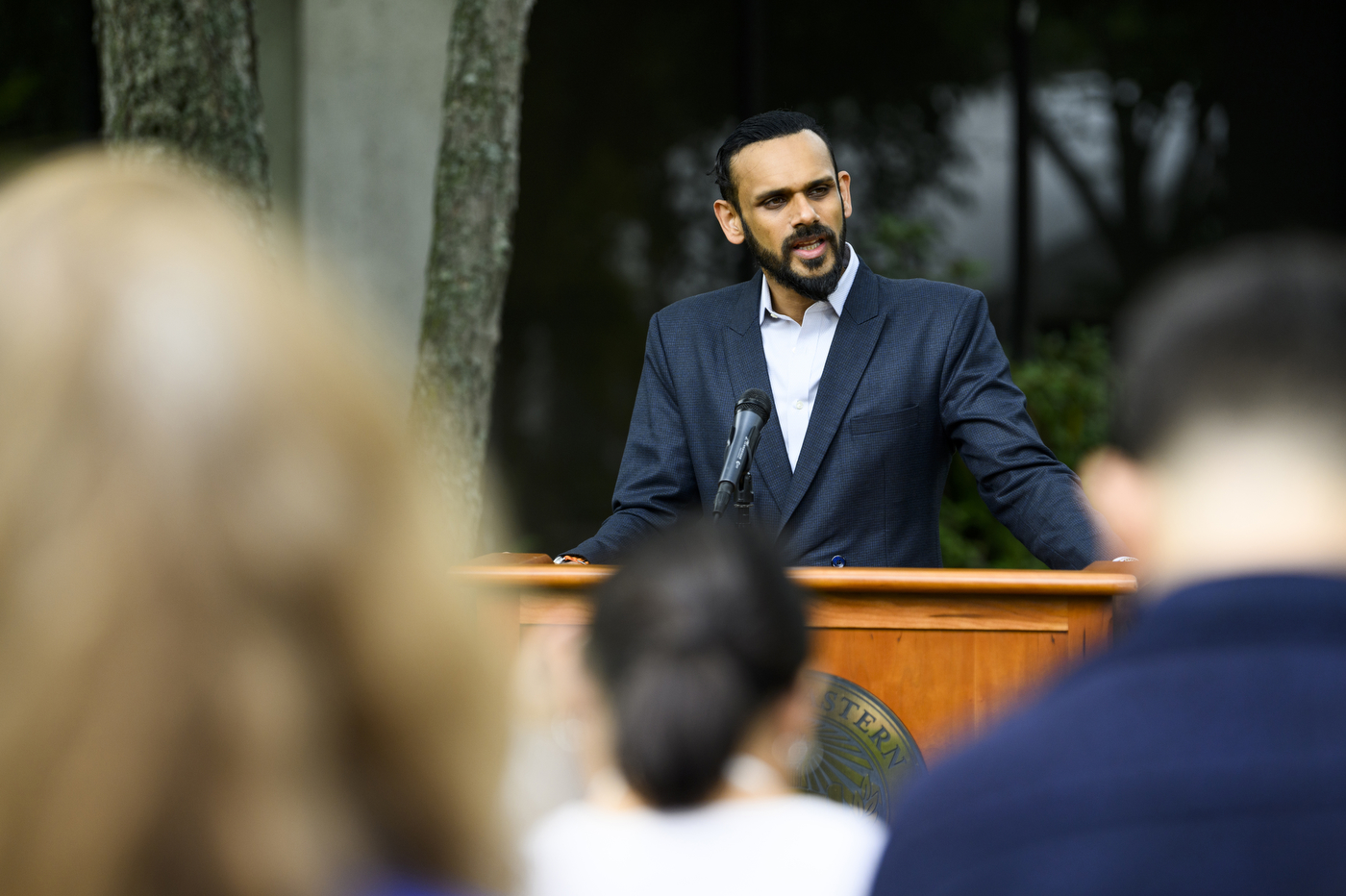 Satyajit Dattagupta speaking at gathering to honor the memory of Jaahnavi Kandula.