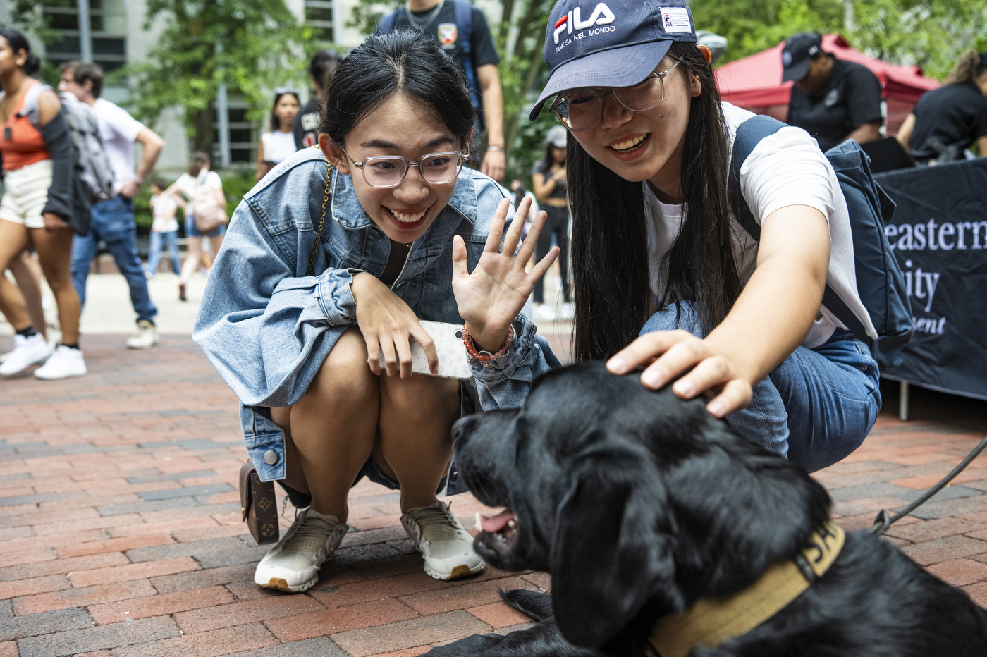 students petting and waving at Sarge