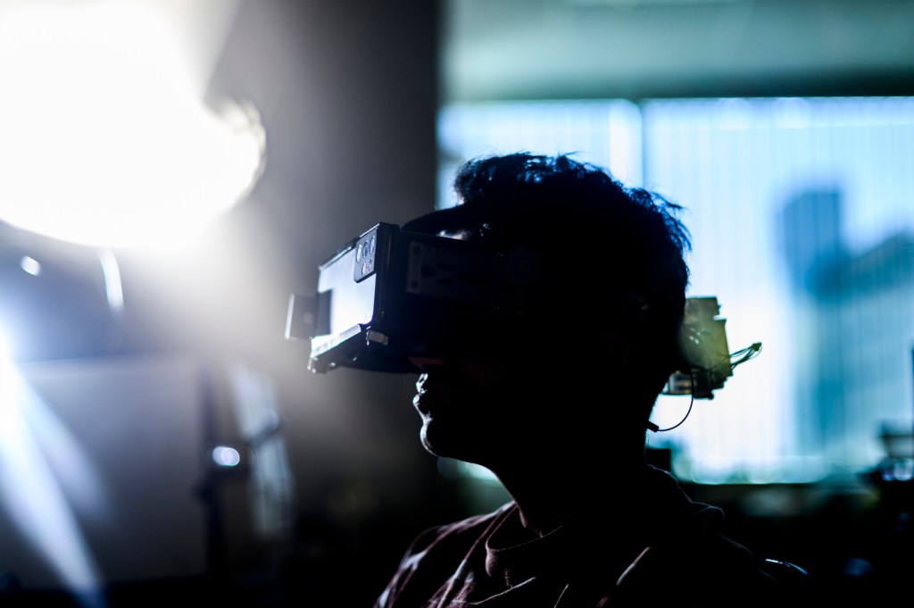 Srinivas Sridhar demonstrating a NeuroVEP headset.