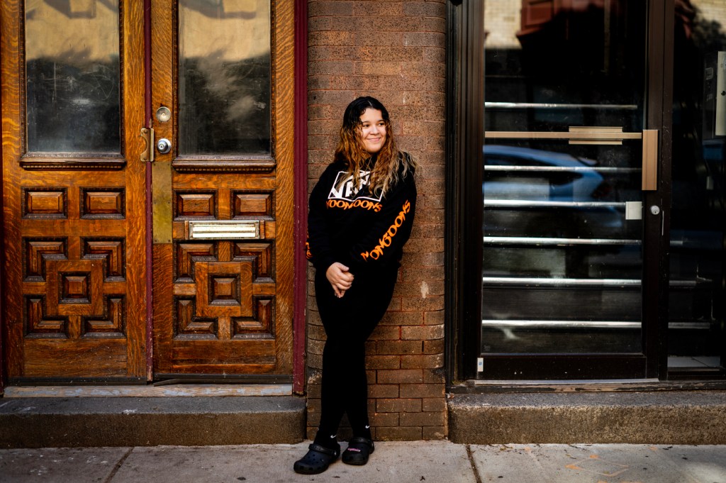 Adelia Argueta posing outside of a building.