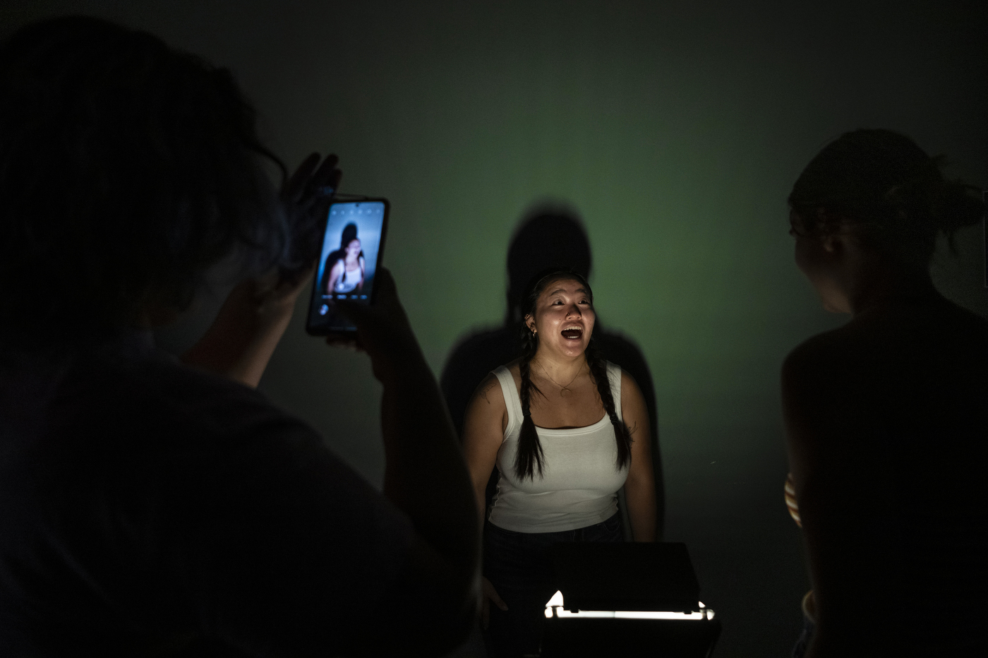 Students posing in different types of lighting.