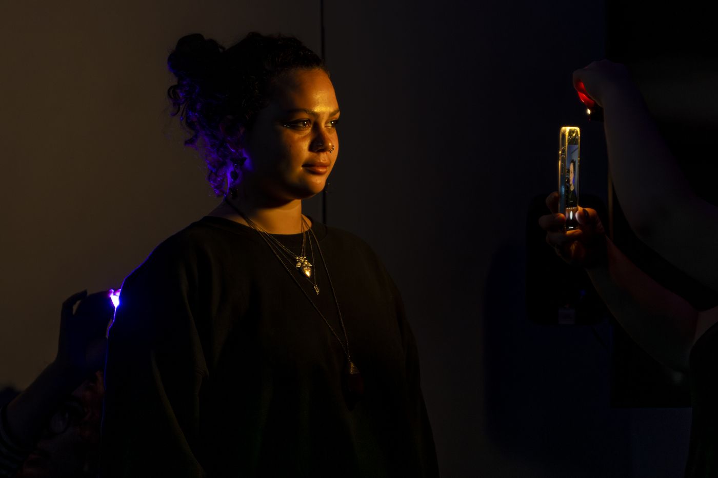 Students posing in different types of lighting.