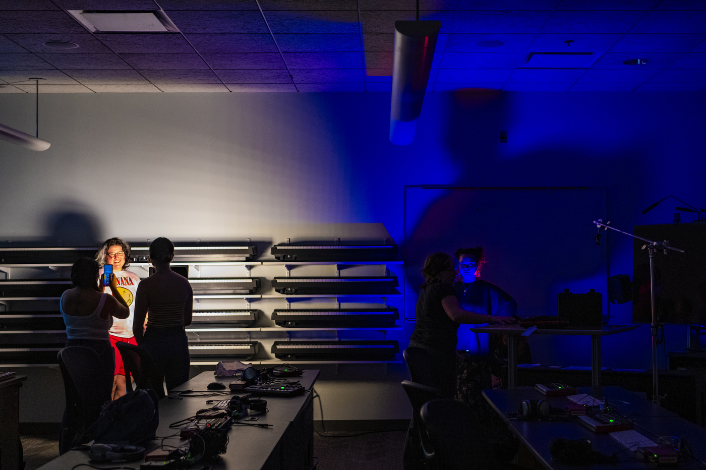 Students posing in different types of lighting.