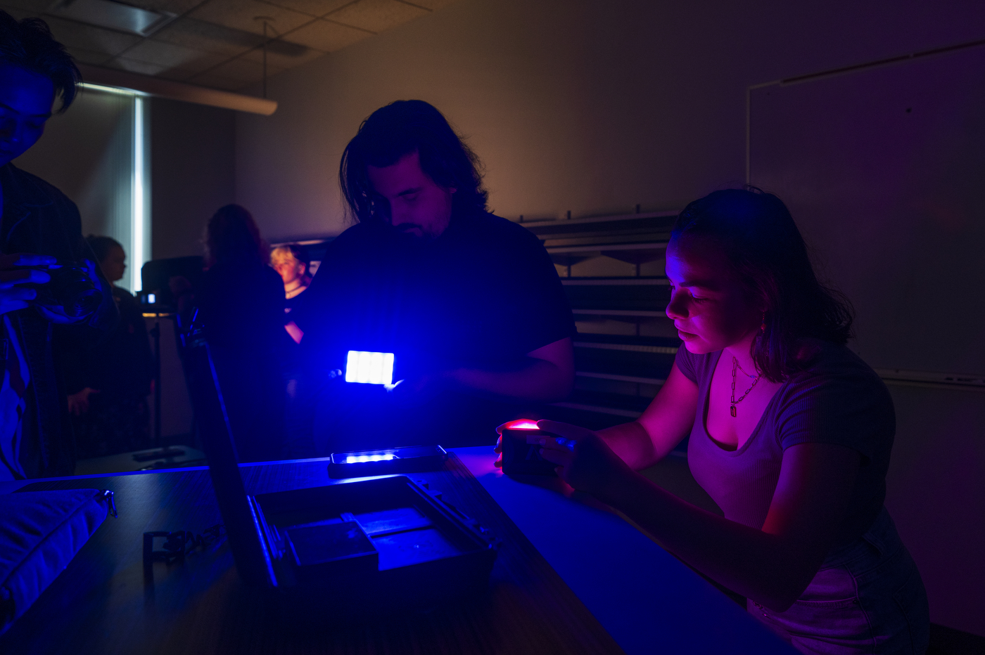 Students posing in different types of lighting.