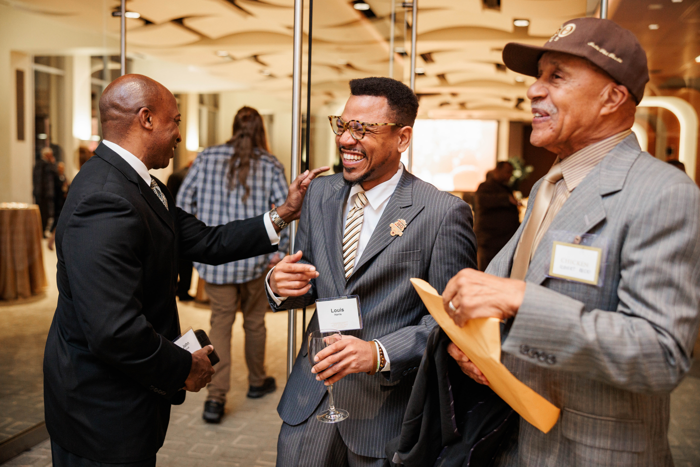 Members of Iota Phi Theta laughing together.