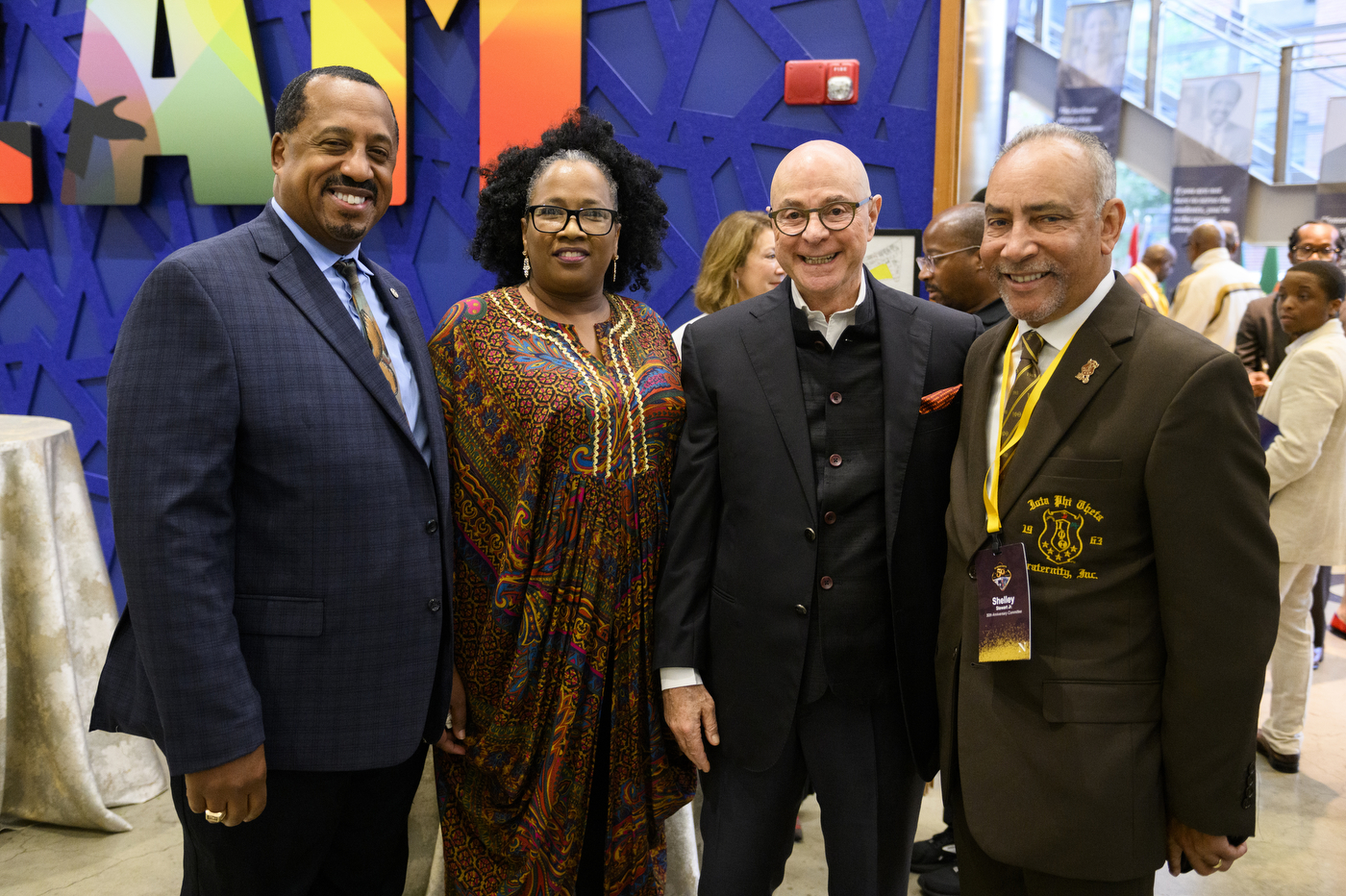 President Aoun posing with people at Iota Phi Theta's 50th Anniversary.