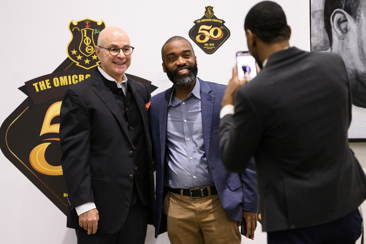 President Aoun posing for a photo with a member of Iota Phi Theta.