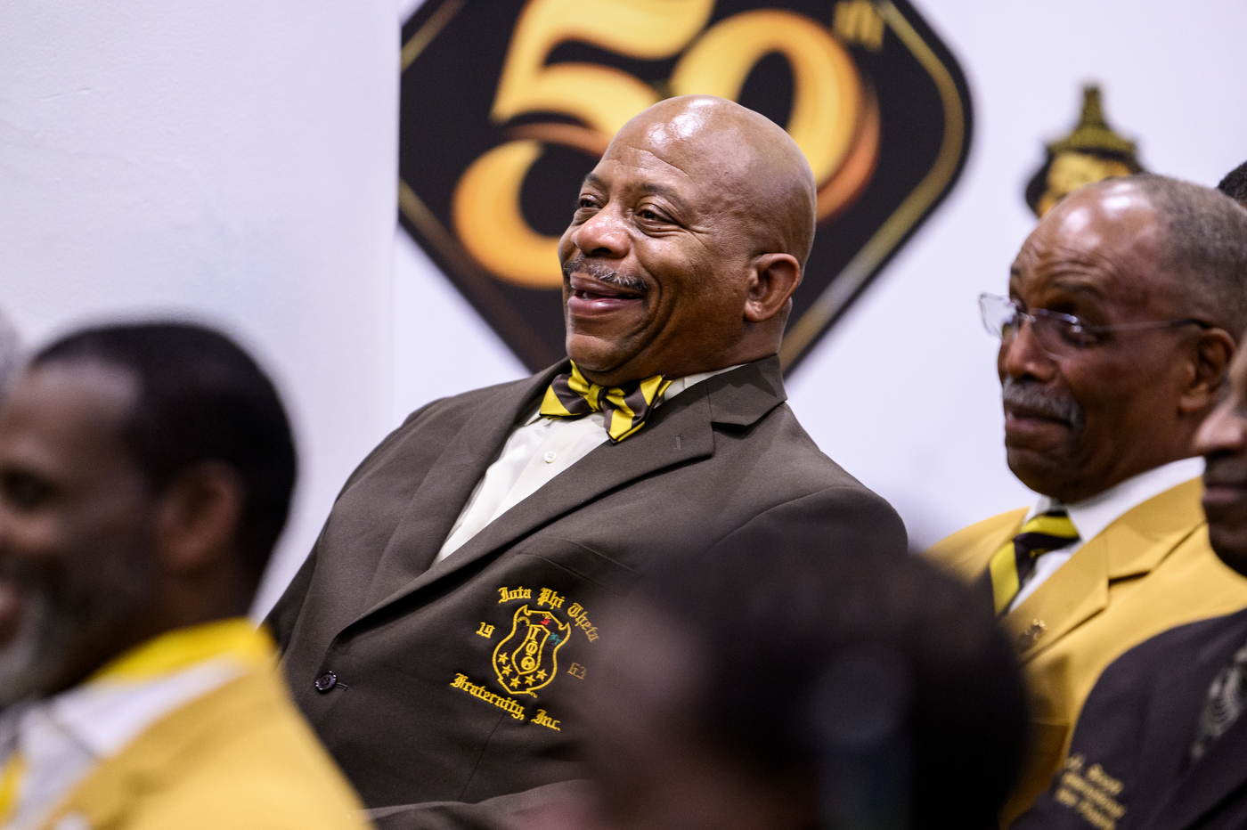 Audience member at Iota Phi Theta's 50th anniversary. 