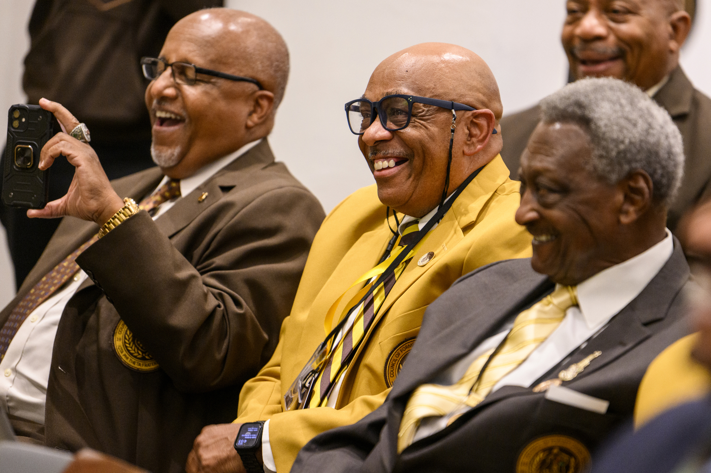 Members of Iota Phi Theta laughing together.