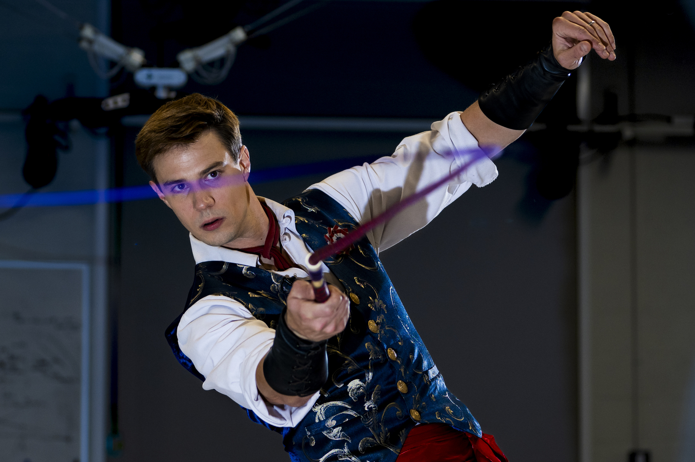 A person preforms human motor control with a whip.