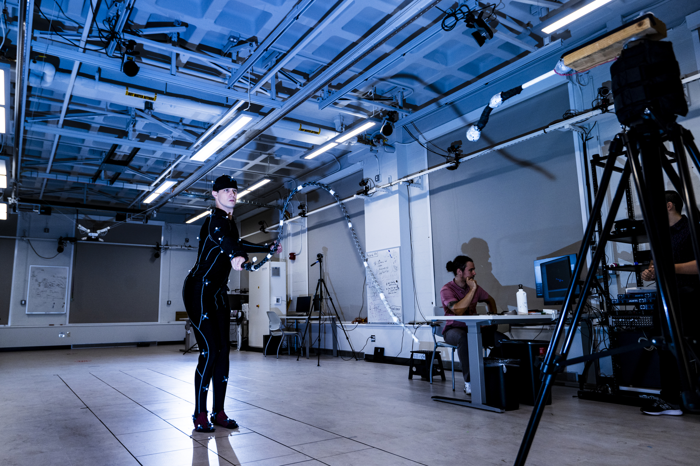 A person preforms human motor control with a whip.