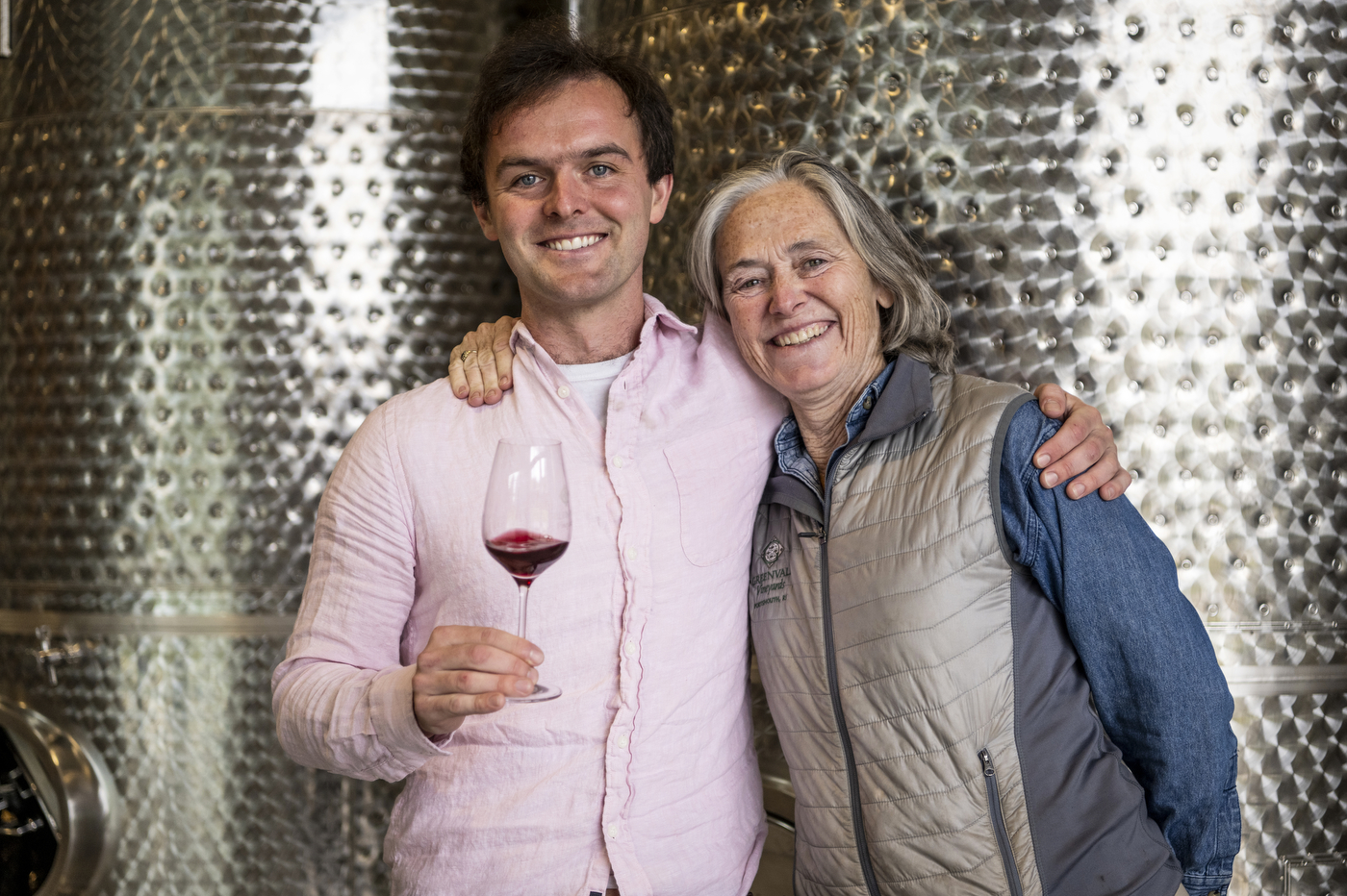 Bill Wilson posing with his mother Nancy Wilson and a glass of red wine.