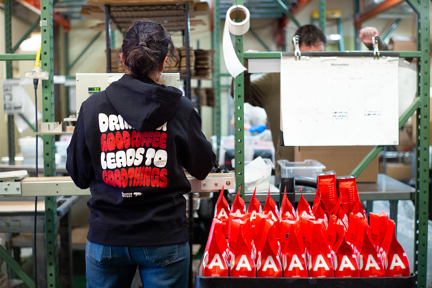 A person working in an Equator Coffees manufacturing room.