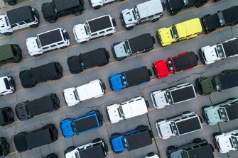 Aerial photo of cars lined up at the Stellantis Chrysler Toledo Assembly Plant.