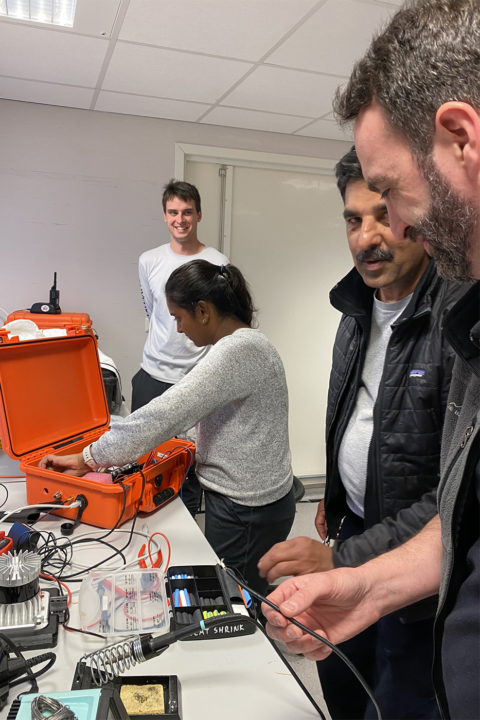 Engineers working on tools used to 3D map melting glaciers. 