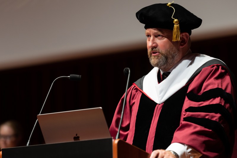 A person speaks at a podium.