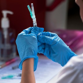 Julie Roszak preparing a flu shot.