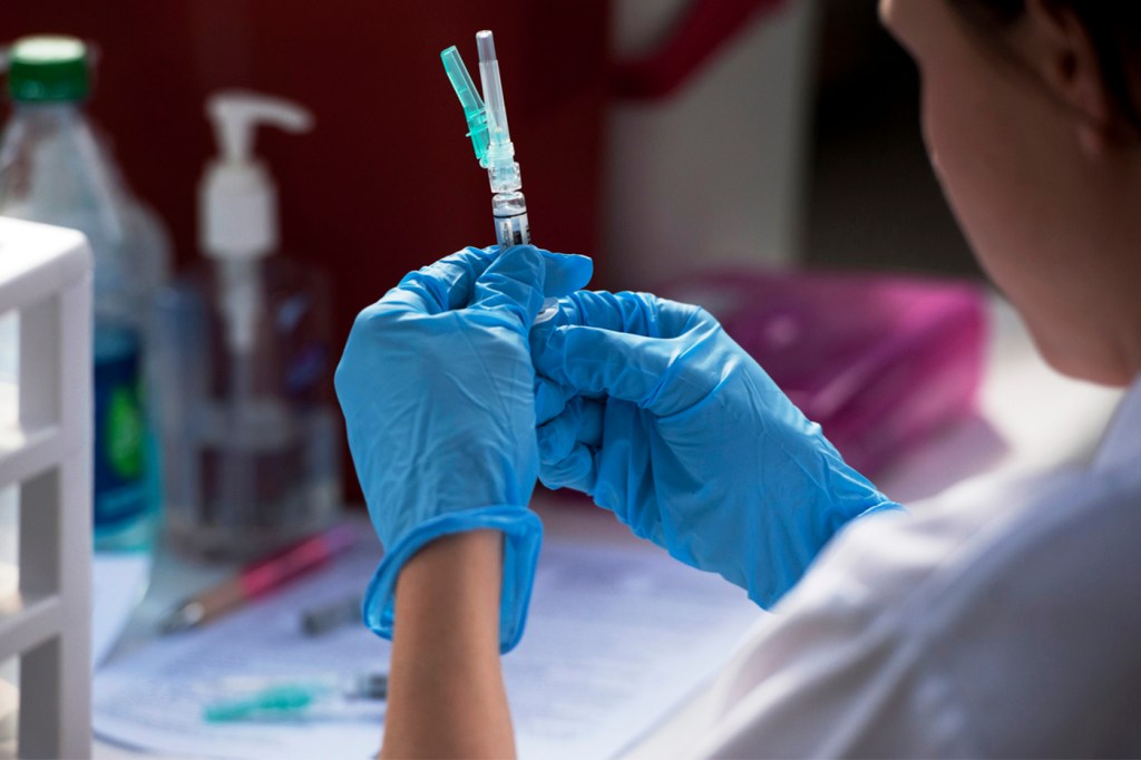 Julie Roszak preparing a flu shot.