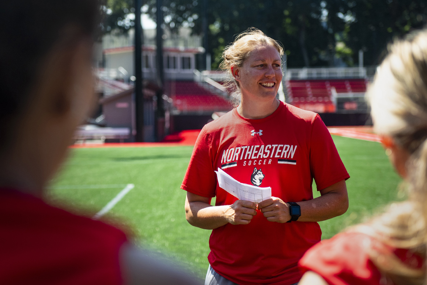 Ashley Phillips coaching the Northeastern women's soccer team.