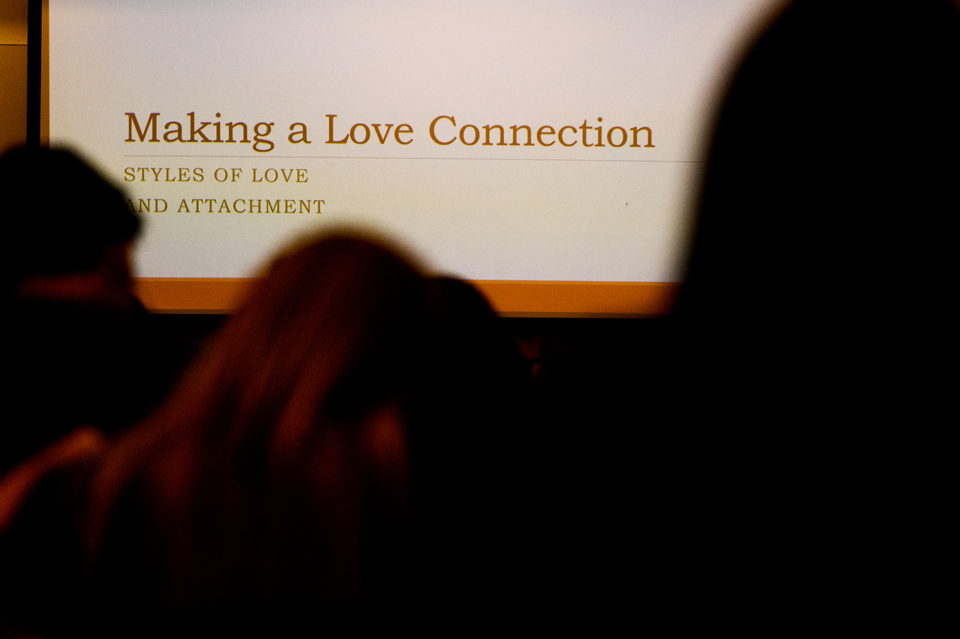 Projected Powerpoint title slide that says "Making a Love Connection"