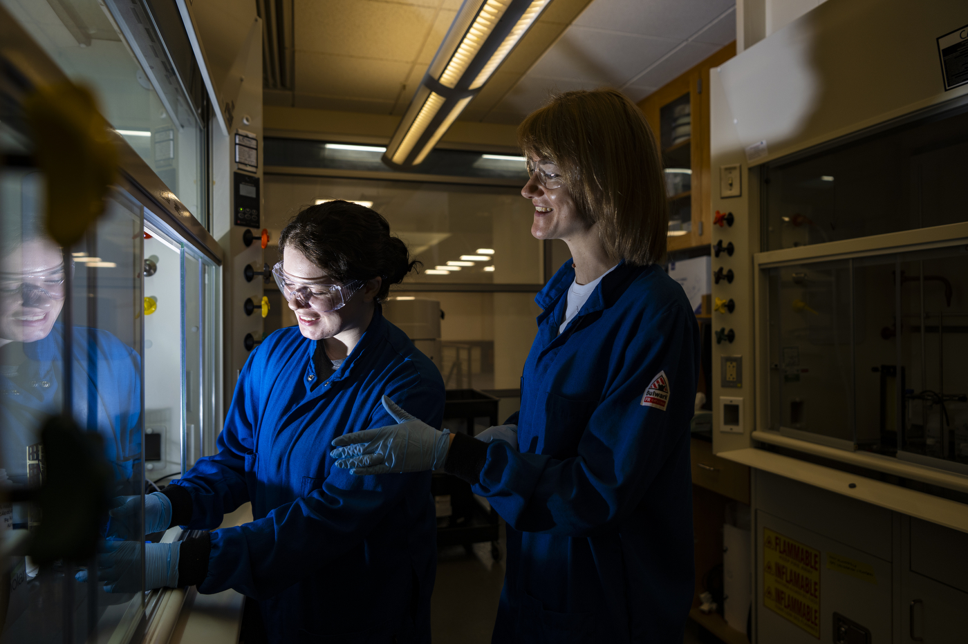 Magda H. Barecka and another person working in the lab.