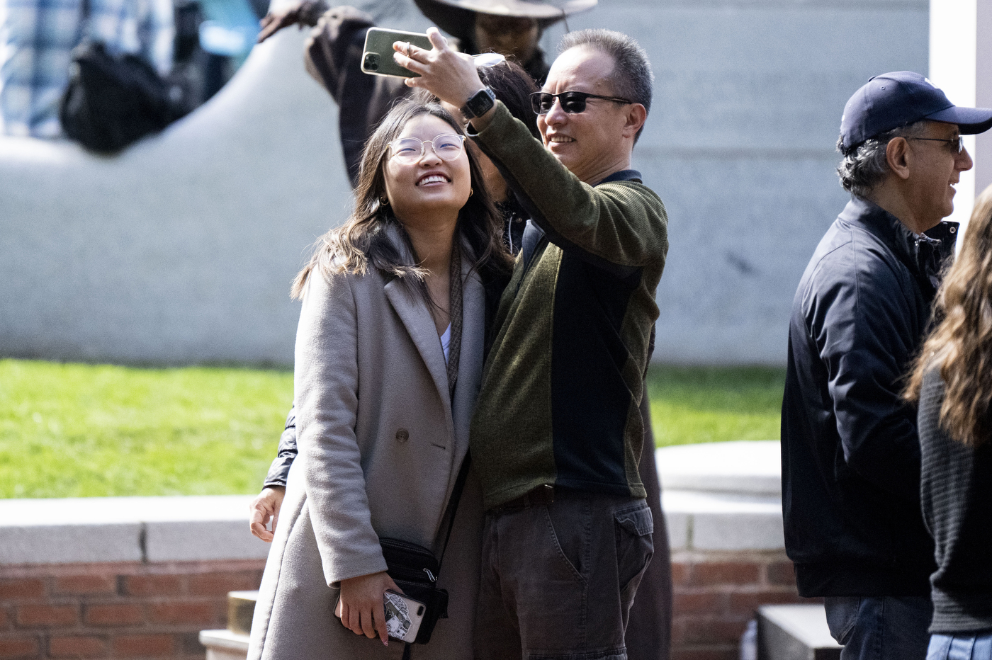 People posing for a selfie together at Family and Friends weekend.