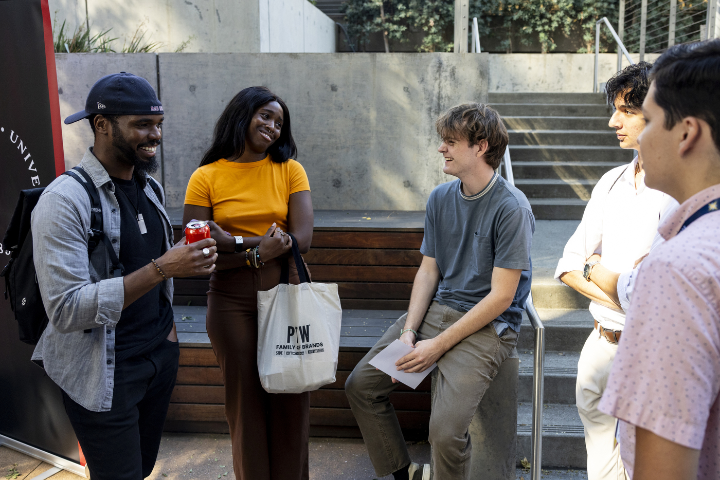 CJ Paillant and Kristine Umeh speaking with students at Northeastern's Oakland campus.