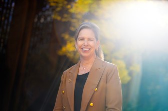 Headshot of Mary Ludden with the glow of the sun behind her.