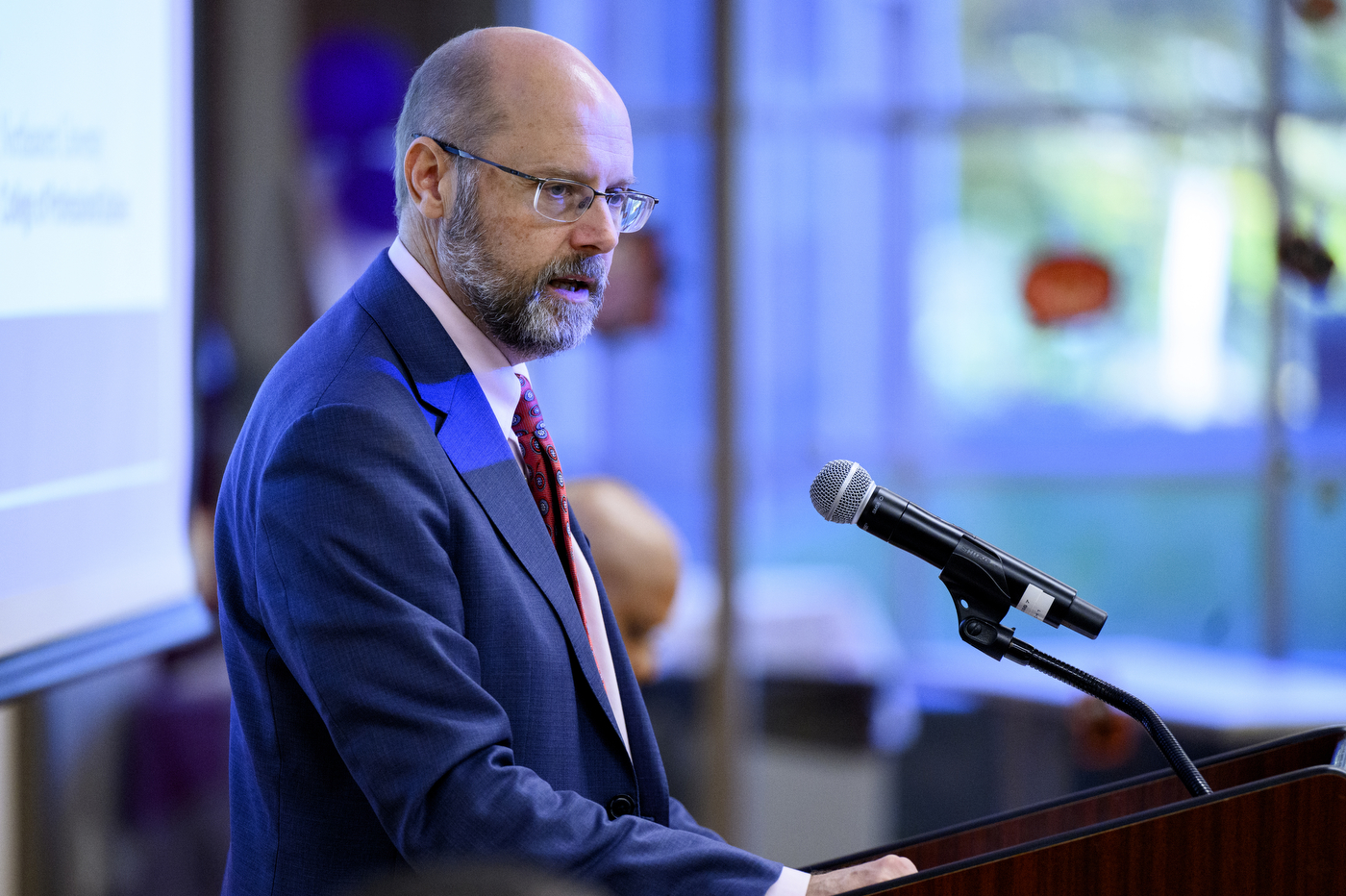 Northeastern University Chancellor Ken Henderson speaking at the event with Roxbury Community College.