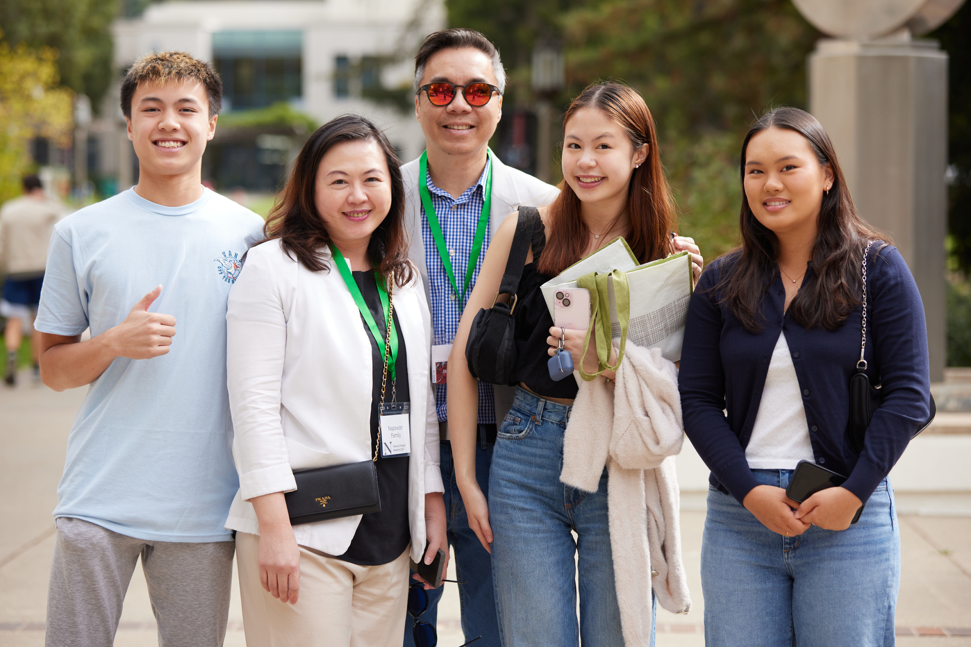 A family posing together on the Oakland campus.