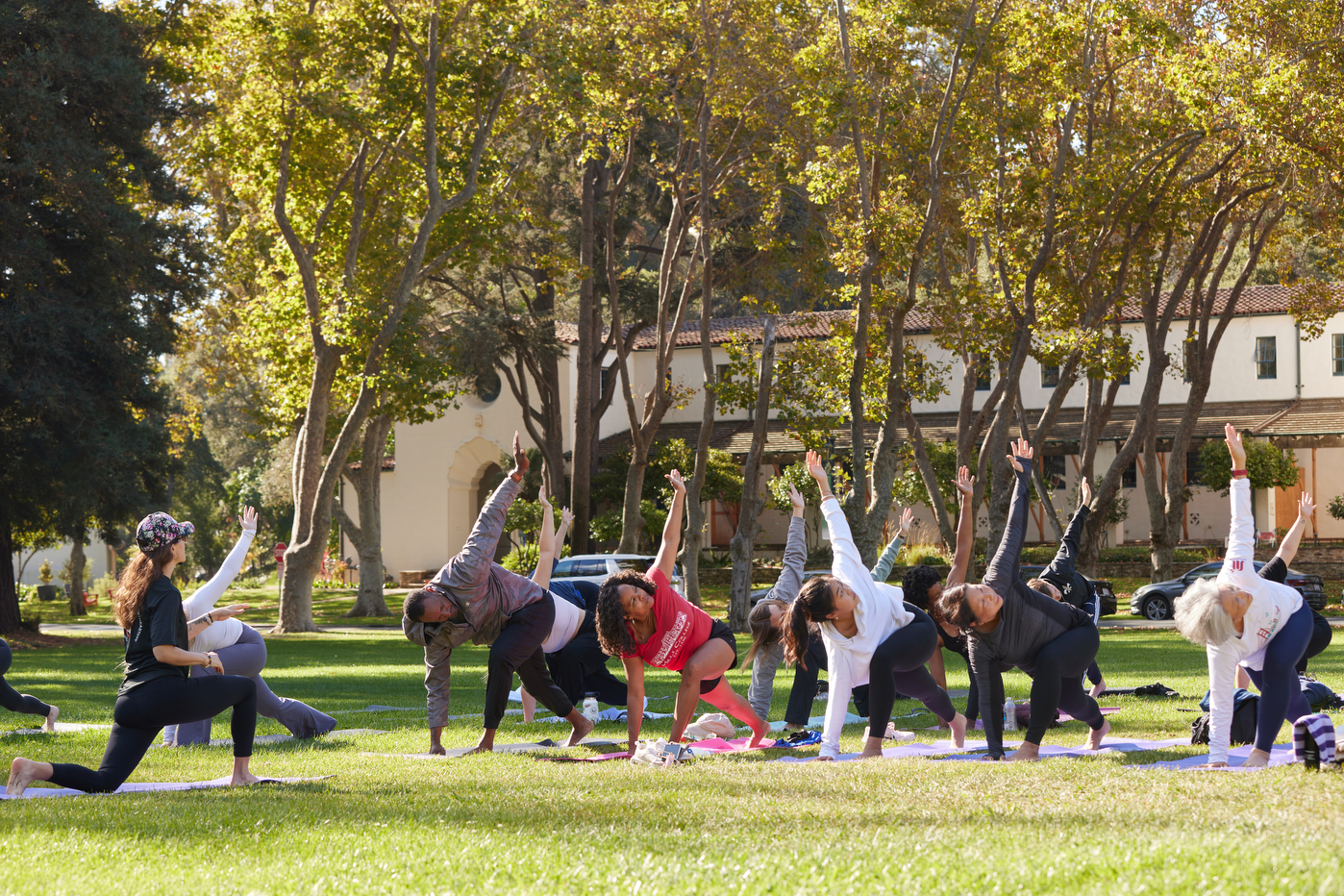 People participating in a yoga class on Oakland's campus.