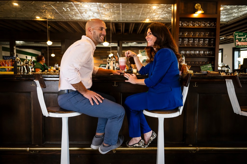 Christina and Ken Procaccianti seated at the ice cream bar in Green Line Apothecary.