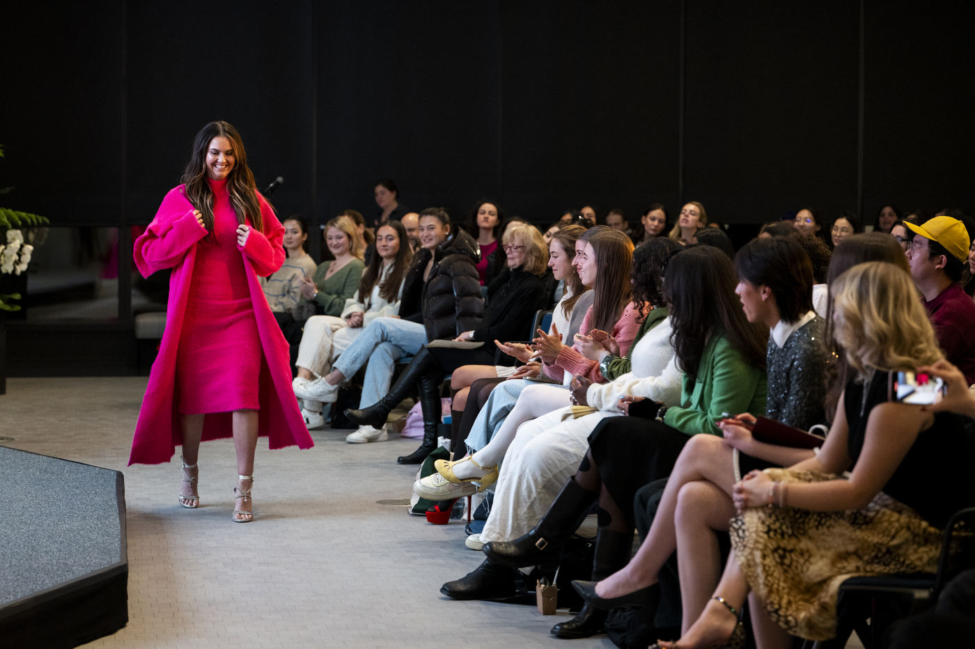 Student modeling a pair of $1 million diamond studded Stuart Weitzman heels. 