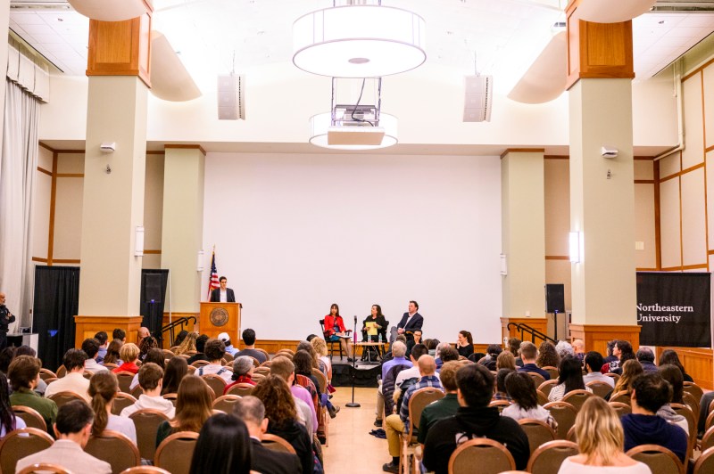 Northeastern community members assembled in a large room. 