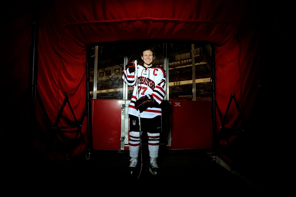 Kendall Coyne posing in her hockey gear