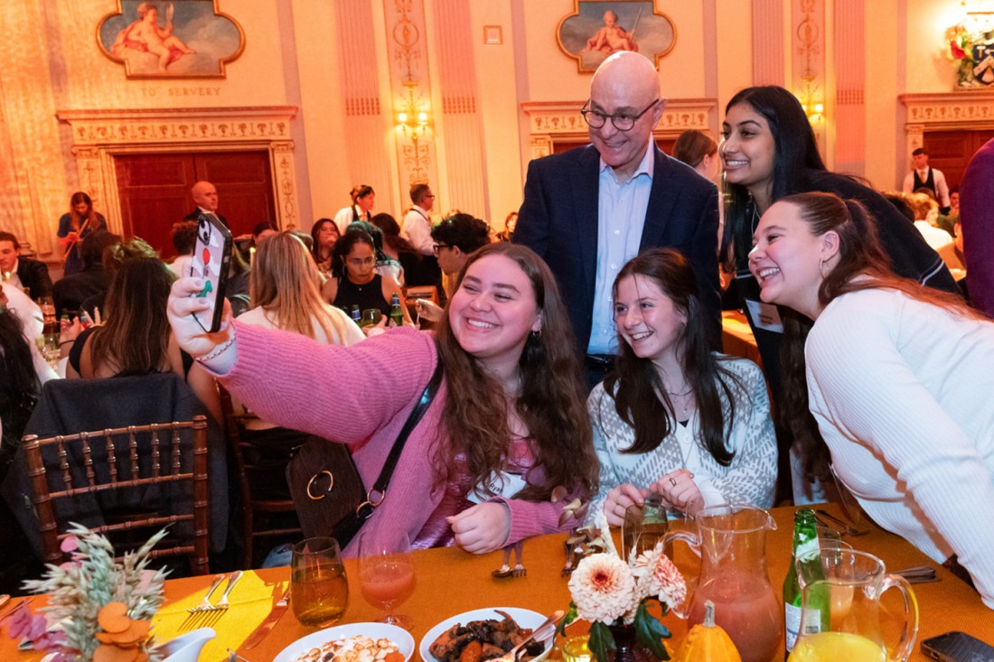 President Aoun taking a selfie with four students. 